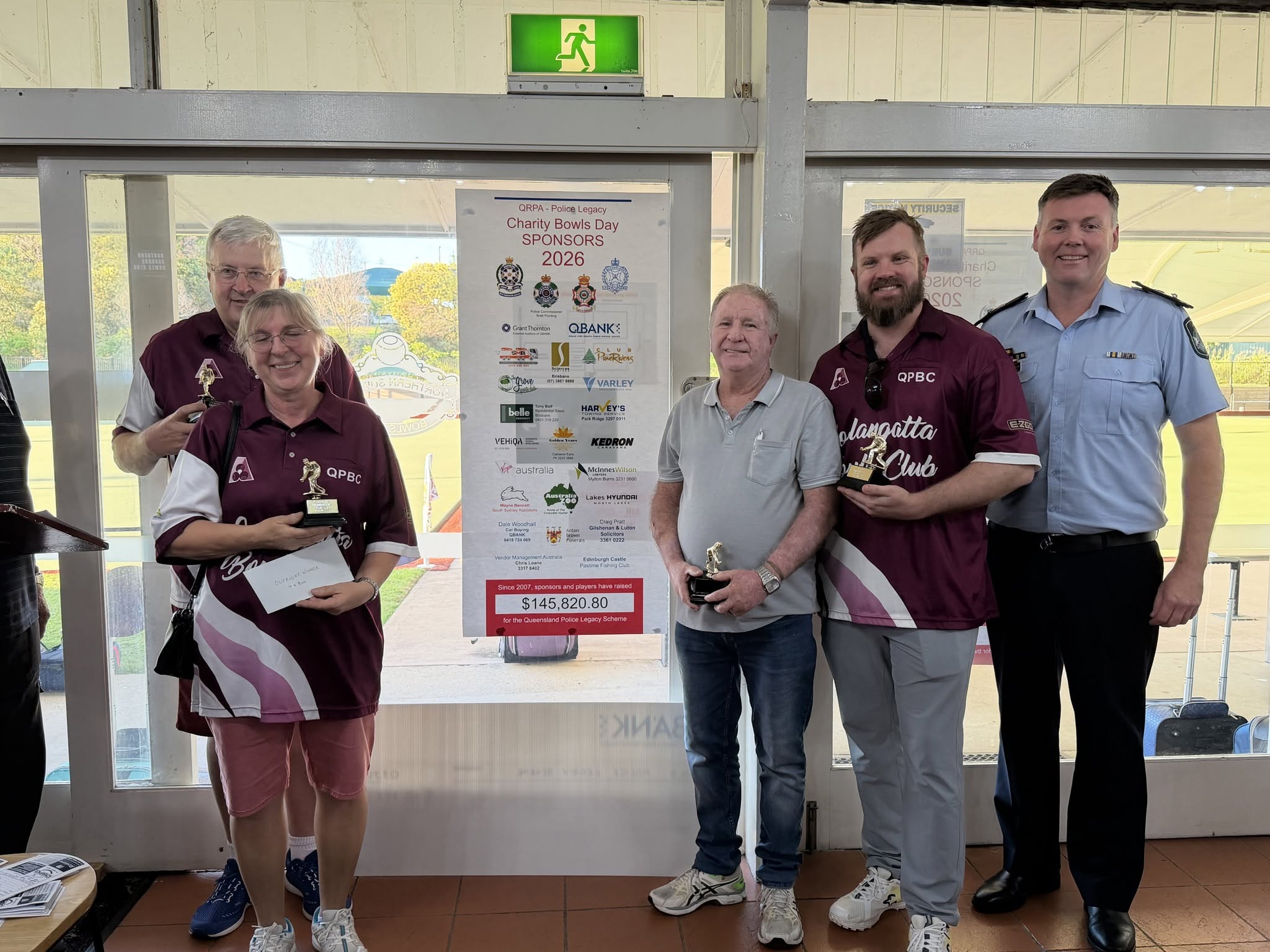 Charity Bowls Day – Queensland Police Legacy with sponsors and police officer.